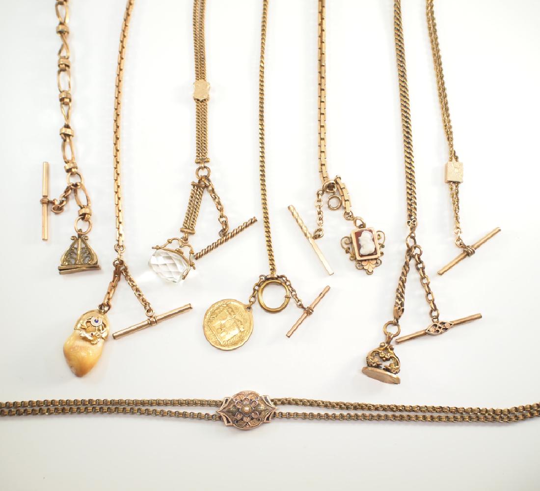 8 Watch Chains: A Collection of Eight Pocket Watch Chains. Including 1 Victorian ladies chain with enamel and seed pearl accented slide, 1 chain with Victorian carved Carnelian cameo slide, 1 with French medallion, 1