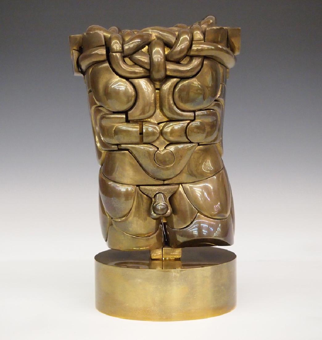M Berrocal Goliath figure: Miguel Berrocal, Spanish, 1933-2006. Multi section Brass puzzle figure entitled "Goliath, Opus 114" depicts a nude male torso. Number 1207 from the 1972 edition of 2000 stamped "Orangerie Multiples, C