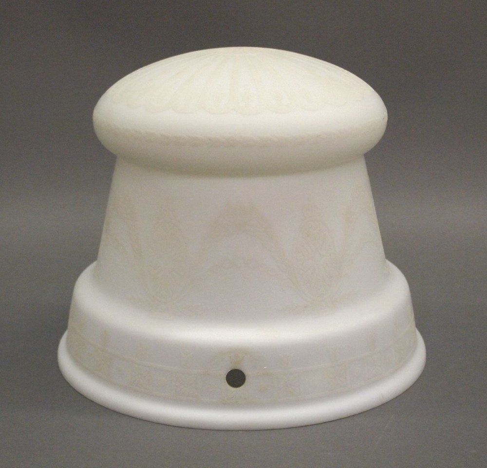 Steuben Style Hanging Shade: An Opaque Glass Hanging Shade attributed to Steuben. Round with narrowed sides and Neoclassical motifs overall. Circa 1920. Minor wear, good condition. 10" diameter, 8" high. ESTIMATE $100-200