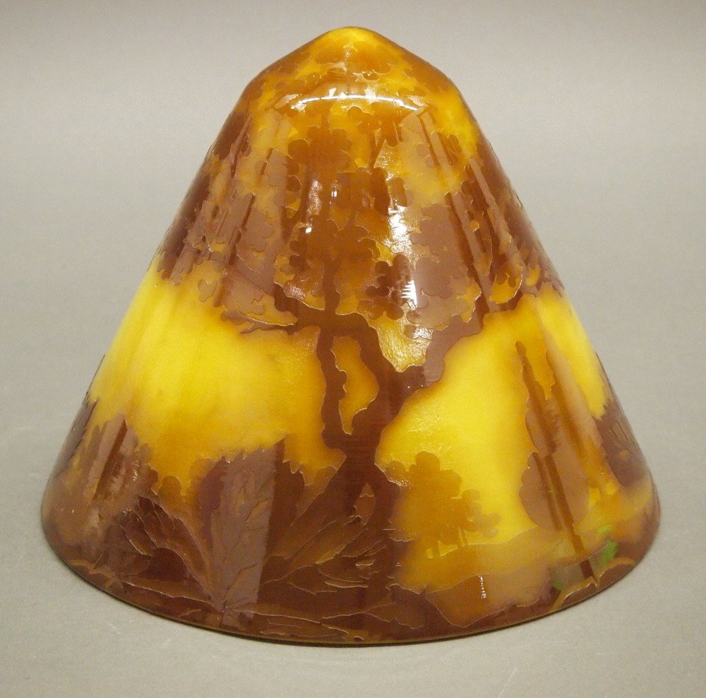 French Style Cameo Glass Shade: A French Style Cameo Glass Shade. Conical shape with carved landscape highlighted in brown on a lemon yellow ground. No apparent markings. Good condition. 7 3/4" diameter, 7" high. ESTIMATE $100-200