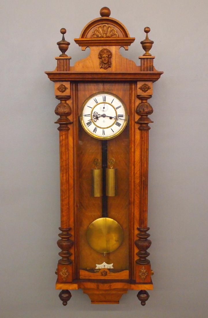 Gustav Becker 2 wt Vienna Regulator: A late 19th century Gustav Becker two weight Vienna Regulator wall clock. 8-day time and strike movement with two part porcelain dial with seconds bit. Walnut case with shaped crown over a single long