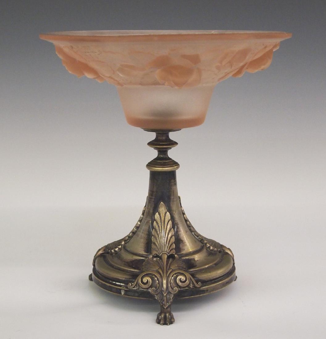 Mueller Freres bowl on stand: An early 20th century Muller Freres Art Glass bowl on stand. A frosted Pink bowl with floral design sits atop a silver plated tripod base. Signed "Muller Freres, Luneville" in the glass. Minor wear, t
