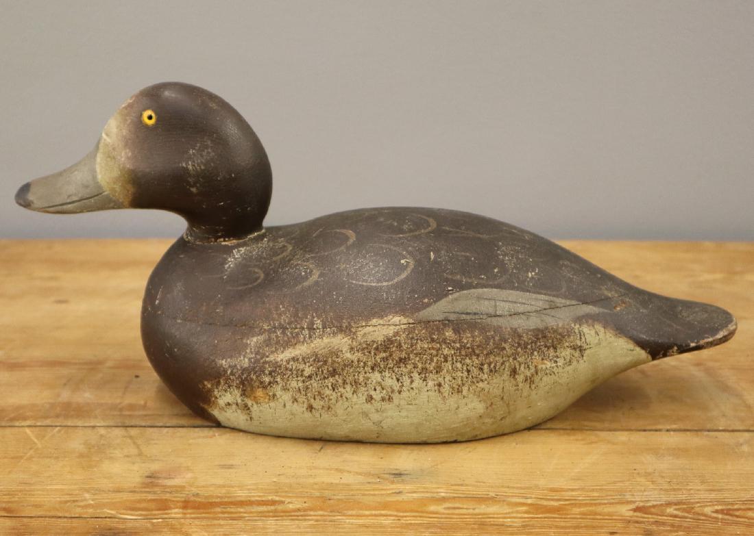 Mason Red Head Hen Decoy: A Mason Red Head Hen Decoy. Premier grade carved wood duck decoy with original paint and glass eyes. Some wear and losses to the paint, loss to neck filler, some chips and separating to the wood, seam