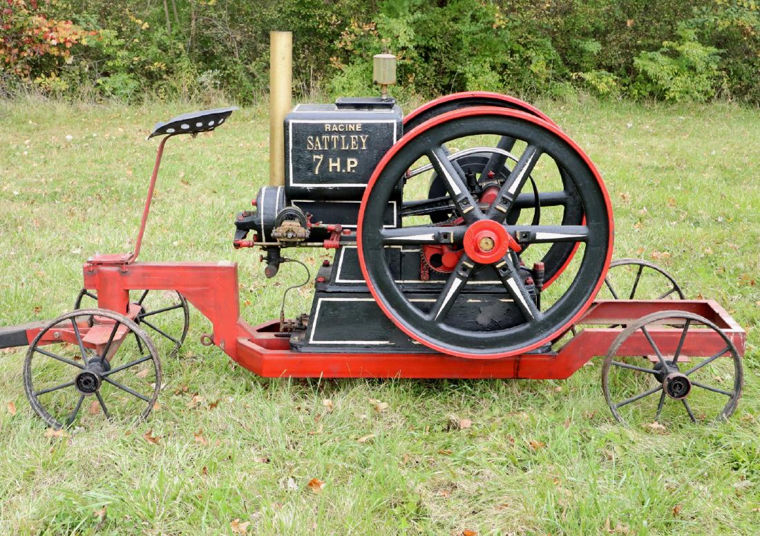 Racine Sattley Engine: A Racine Sattley Hit and Miss Engine. Marked "The Racine Sattley, Montgomery Ward & Co., New York, Chicago, Kansas City, Fort Worth Portland No. 13764 H.P. 7 Speed 375", on a later iron cart. Restored