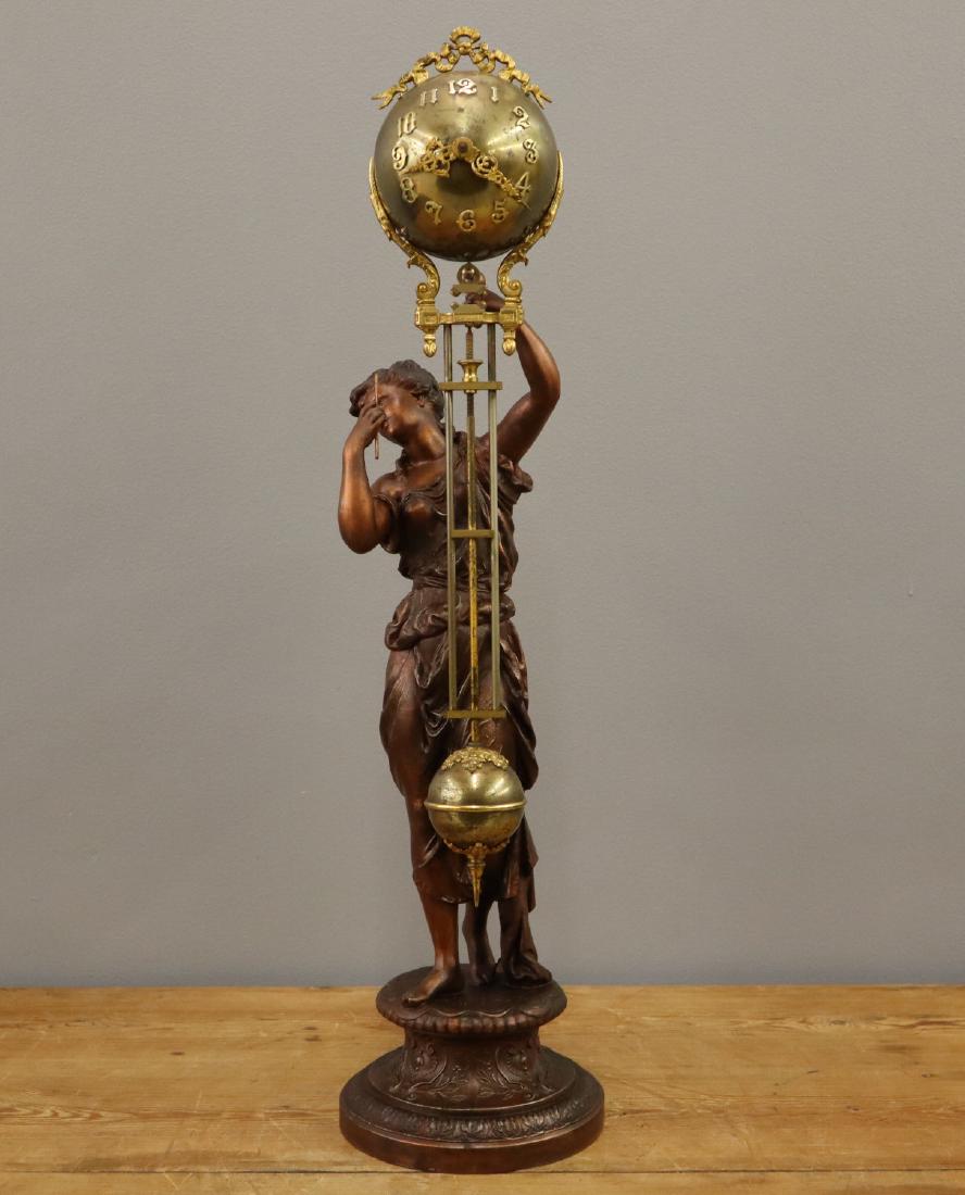 Ansonia "Juno" swinger clock: A late 19th century Ansonia "Juno" model swinger statue clock. Signed 8-day time only movement. Restored finish on statue, replaced suspension and hanger rod. Running when cataloged. 28" high overall.