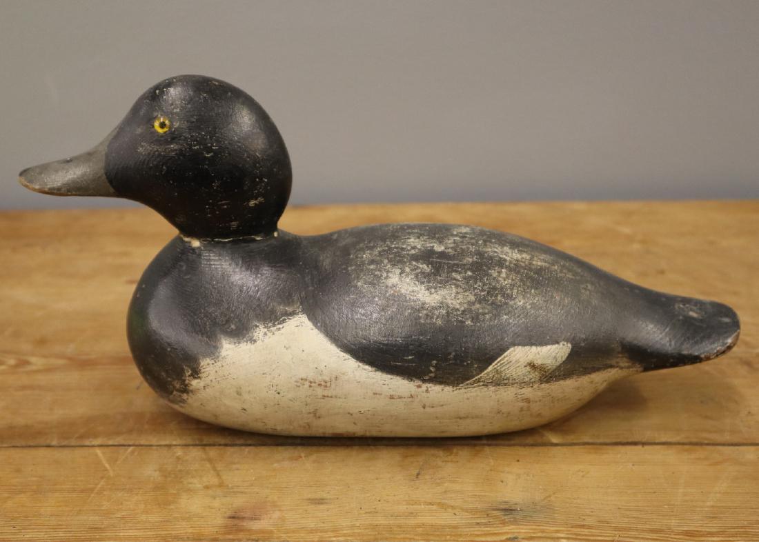 Mason Blue Bill Drake Decoy: A Mason Blue Bill Drake Decoy. Standard grade carved wood duck decoy with original paint and glass eyes. The right glass eye has lost the yellow coloring, the left eye has either been replaced or repa
