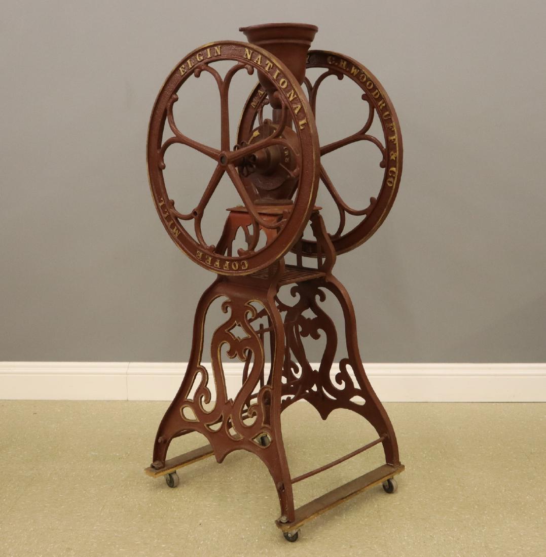 C.H. Woodruff & Co. Floor Model Coffee Mill: A 19th century C.H. Woodruff & Co. Floor Model Coffee Mill. Painted cast iron coffee grinder; marked "Manf'd by C.H. Woodruff & Co. Elgin, Ill. Elgin National Coffee Mill". Lacks a handle, wear and so