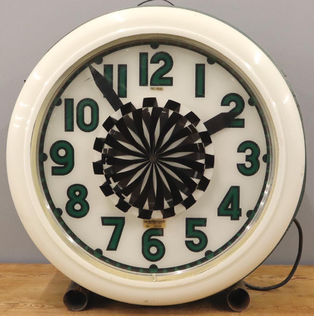 Electric Neon Clock Co. Wall Clock: A mid 20th century Wall Clock by Electric Neon Clock Co. Round, neon clock marked "Electric Neon Clock Co. Cleveland Ohio" in a metal case. Clock does not run, neon tube broken, minor wear. 26" diamet