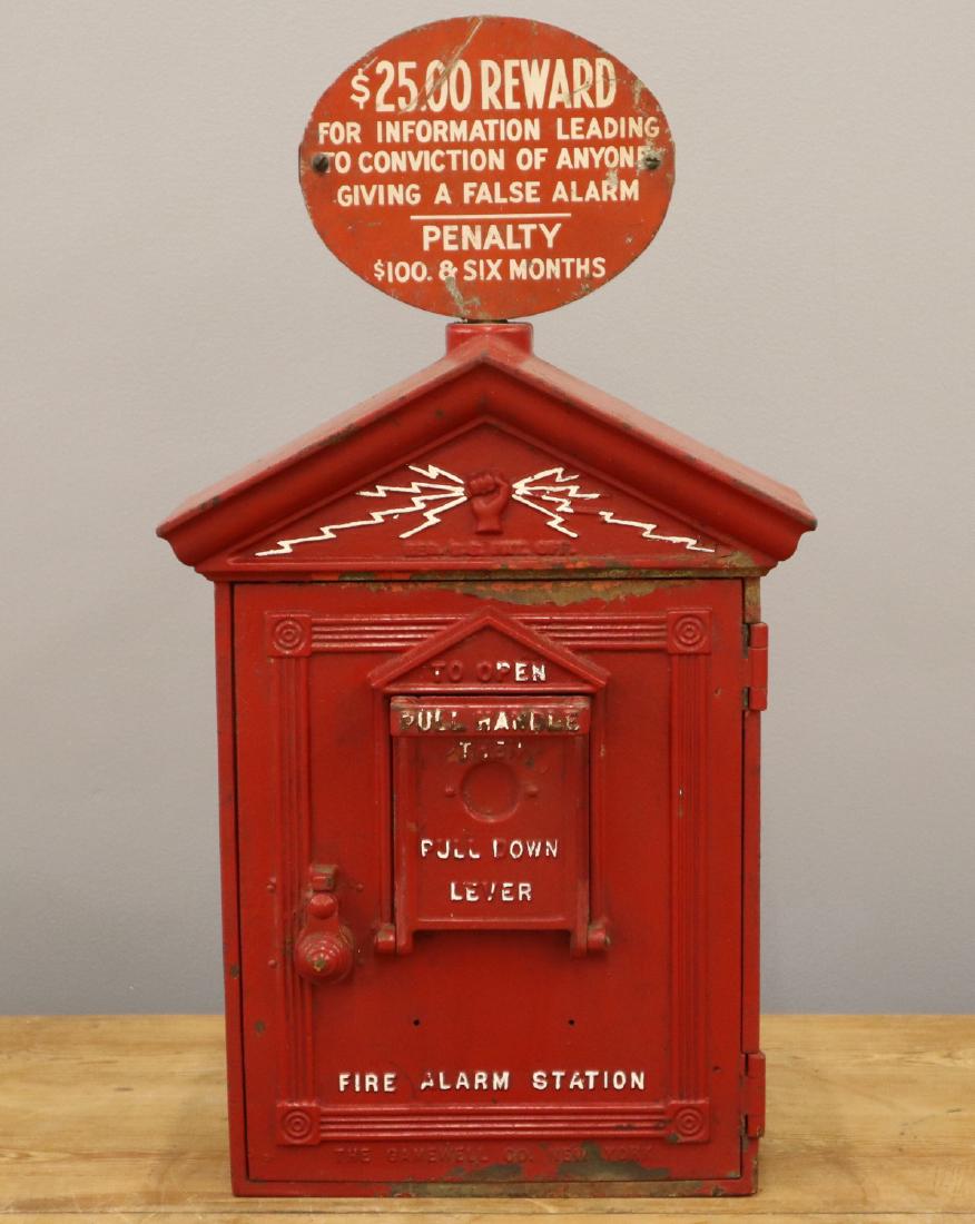 Gamewell Co. Fire Alarm Call Box: An early 20th century Gamewell Co. Cast Iron Fire Alarm Call Box. Includes a booklet of Detroit Fire Call Box locations. Red painted finish with wear and corrosion. 24" high. ESTIMATE $100-200