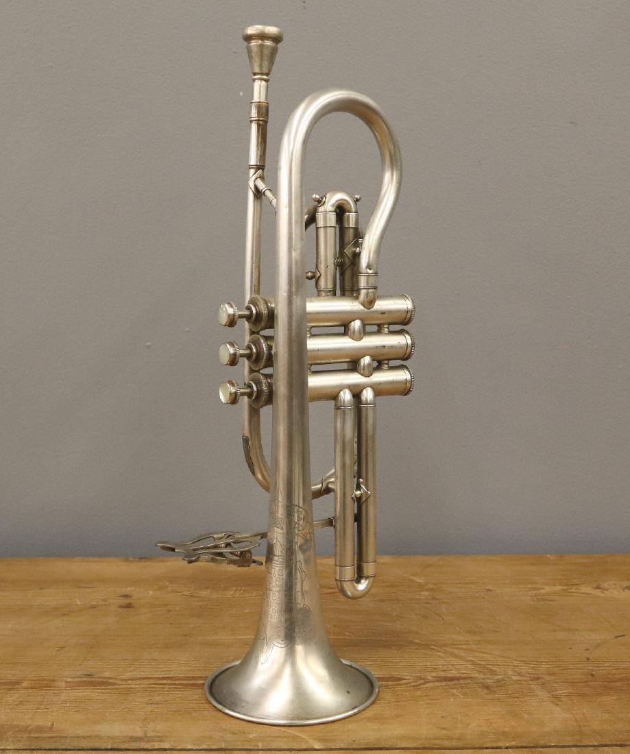 Ohio Band Instrument Co. Cornet: A mid 20th century Ohio Band Instrument Co. Cornet. Engraved "Soloist The Regent Ohio Band Instrument Co. Cleveland O", serial number 28209. Includes a case. Wear and minor denting. 16 3/4" long. ESTI
