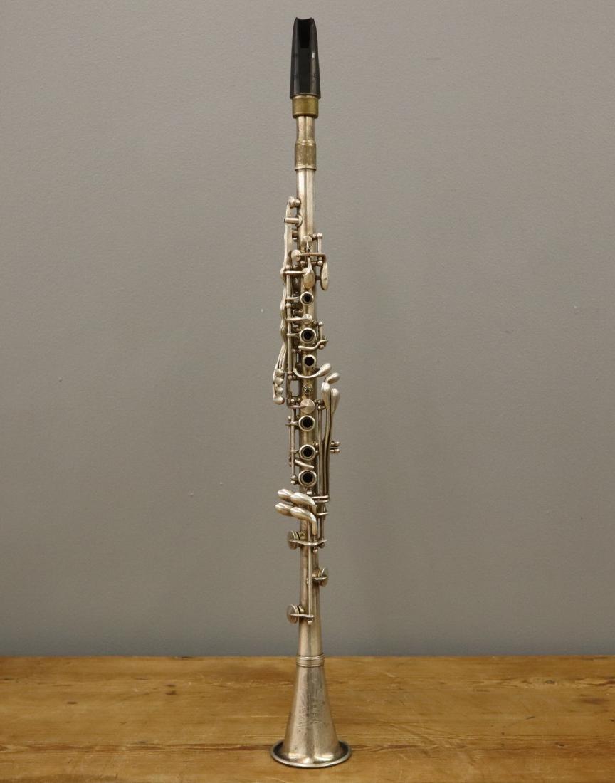 Pedler Co. Clarinet: A mid 20th century Pedler Co. Clarinet. Engraved "Pedler American Elkhart-Ind.", serial number 37520. Includes a case. Wear and minor denting. 26 1/4" long. ESTIMATE $100-200