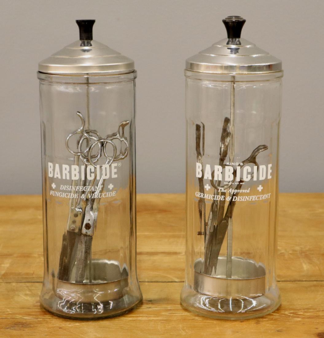 2 Barber's Barbicide Jars: Two 20th century Barber's Barbicide Sterilizing Jars. Minor wear. Each 11 1/4" high. ESTIMATE $50-100