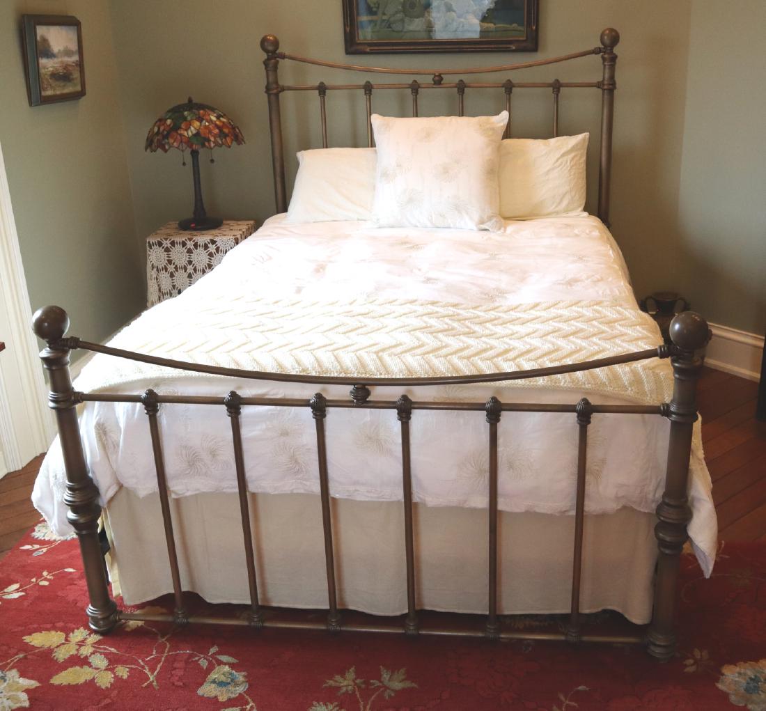 Painted Queen Bed: A Contemporary Queen Size Painted Metal Bed. Frame fits a 59" x 79" mattress. Headboard is 61" high. Wear to the paint. ESTIMATE $200-400