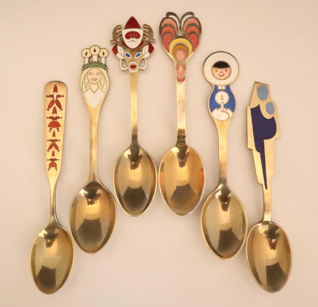 6 A. Michelsen Sterling & Enamel Spoons: Six A. Michelsen Sterling & Enamel Spoons. Each having a different enameled image at the tip; ranging from 1952 to 1972. All marked "A. Michelsen Copenhagen Sterling Denmark". Minor wear to each. Up t