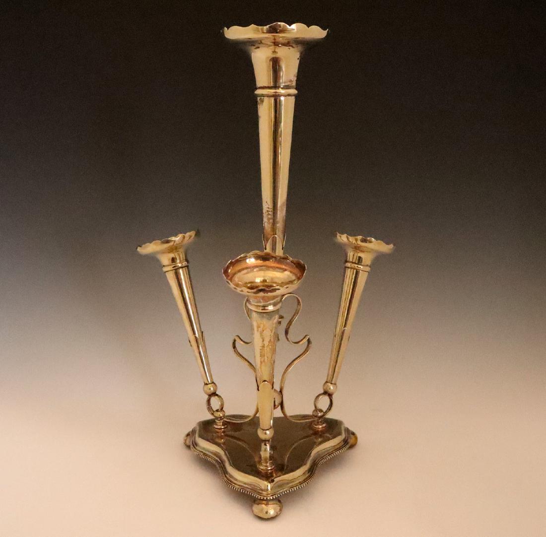 J. Dixon & Sons Silver plate Epergne: A James Dixon & Sons Silver Plate Epergne. Having a large trumpet form vase at the center with three smaller vases at the base. Stamped with maker's marks at the underside. Some surface scratches and