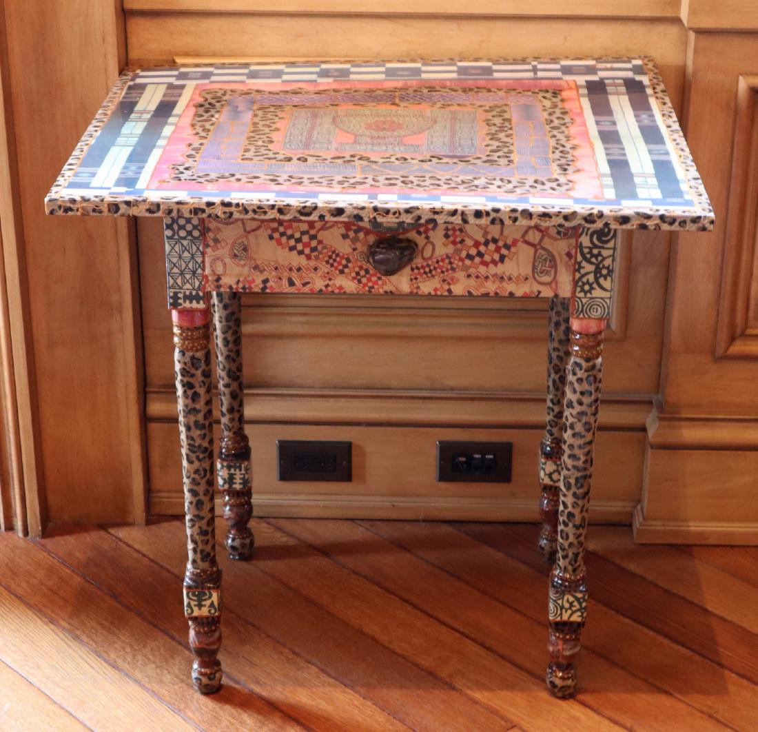 Decoupage Table: A Contemporary Decoupage Table. With painted accents; artist signed. Light wear overall, some cracking to decoration noted. 29" x 23" x 29" high. ESTIMATE $200-300