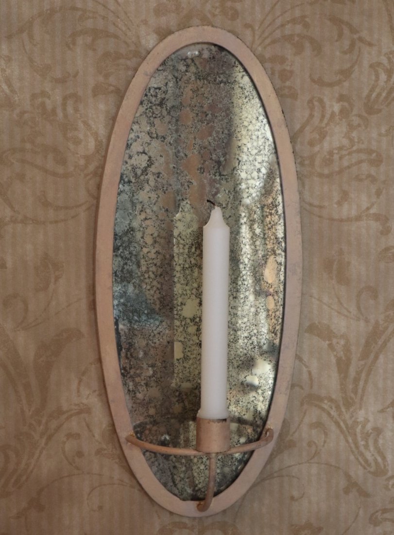 Pr. Of Contemporary Sconces: A Pair of Contemporary Candle Sconces. Each with an oval faux mercury glass back and painted metal frame. Minor wear. 17" high. ESTIMATE $50-100