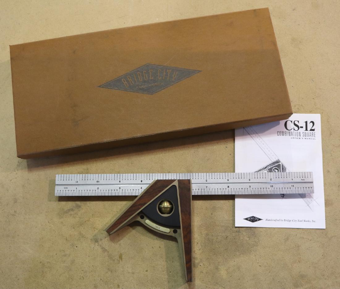 Bridge City English Combo Square: A Bridge City Tool Works CS-12 English combo square. Includes paperwork and original box. Only slight wear. ESTIMATE $100-150