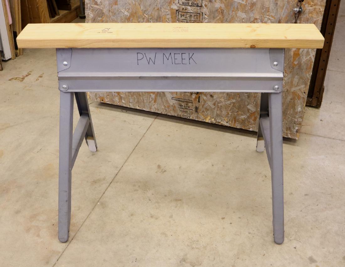 8 Folding Sawhorses: Eight pressed steel folding sawhorses with 2 x 6 tops. Some wear. ESTIMATE $100-200