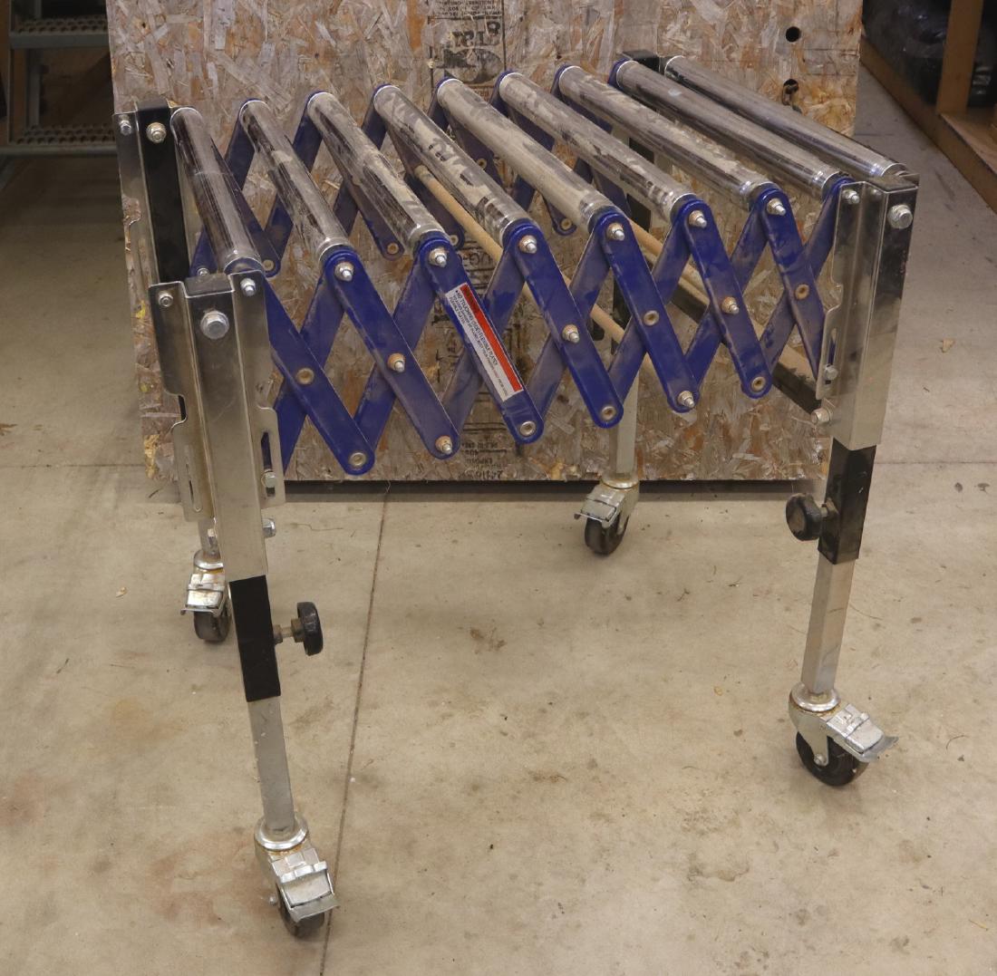 Expanding Roller Table: An expanding roller table with nine 18" rollers. Minor wear. ESTIMATE $40-60
