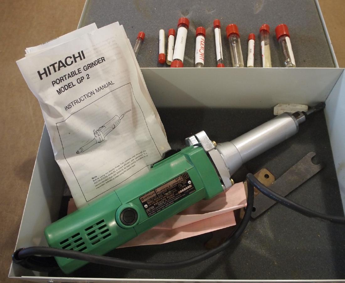Hitachi GP 2 Grinder: A Hitachi GP 2 hand held grinder. In a metal case. Some wear. ESTIMATE $20-40