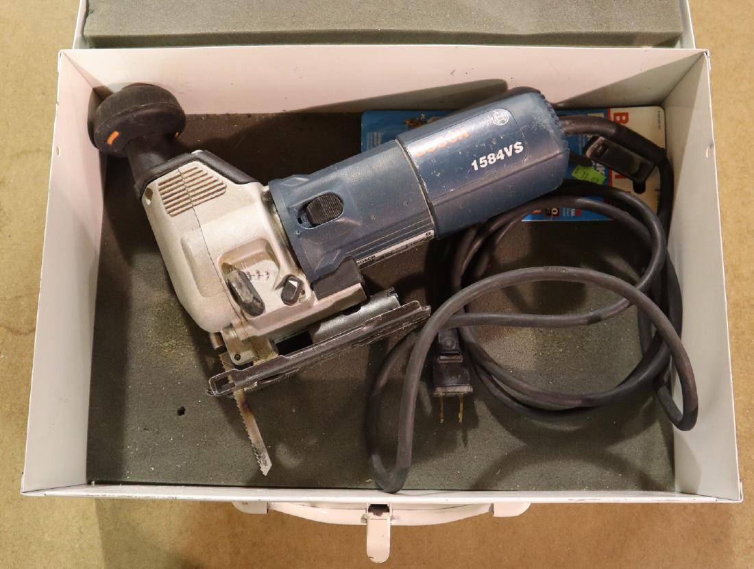 Bosch Jig Saw: A Bosch variable speed jig saw. With metal case. Some wear. ESTIMATE $20-30