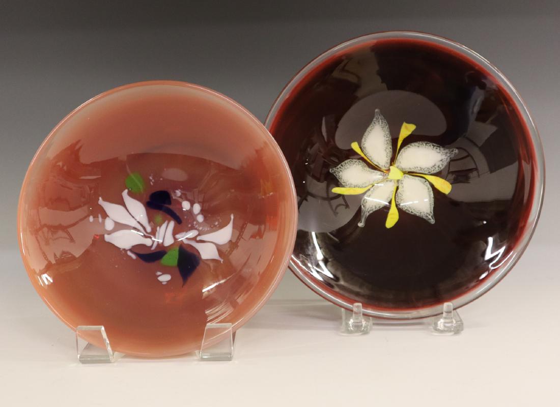2 Labino Studio/Baker O'Brien Glass Bowls: Two Labino Studio Glass Bowls by Baker O'Brien. Each with a floral design at the well. The red bowl is signed and dated "Baker 3/1978" and the pink bowl is signed and dated "Baker Labino Studio 11-198