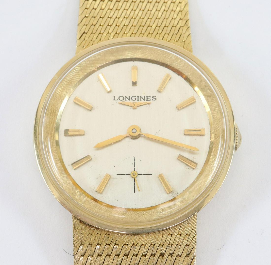 Longines 14k Gold wristwatch: A Longines 14k Gold wristwatch with a 14k Longines mesh strap and buckle. 30mm case with a 17 jewel 370 cal mechanical movement, Silvered dial with subsidiary seconds and Gold baton markers. Serial #1