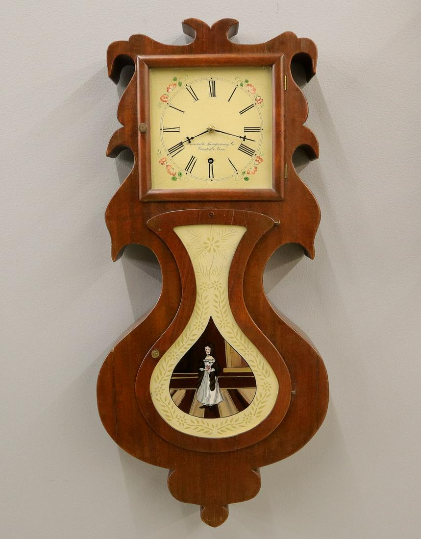 J. C. Brown style Acorn wall clock: A 20th century J. C. Brown style "Acorn" model wall clock. Ansonia 8-day time only movement with a painted metal dial. Mahogany case has been hand built using old wood and a modern reverse painted gla