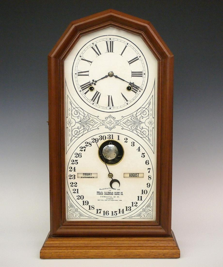 Ithaca Octagon No. 11 Calendar shelf clock: A late 19th century Ithaca "Octagon No. 11" model double dial calendar shelf clock. 8-day time & strike movement with lower calendar mechanism and papered metal dial. In a Walnut case with a single mo