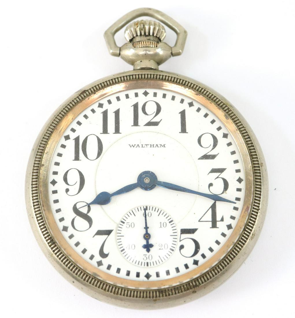 AWW Co. "Vanguard" Railroad watch: AWW Co. "Vanguard" Railroad watch. 16 size, 21 j, Adj 5 pos, Swing out mvt, DMK, GJS, SW, LS, Star "Silver", OF, DSD w/Arabic numerals. Serial #25897047. Minor case wear, hairline in dial, winds, sets