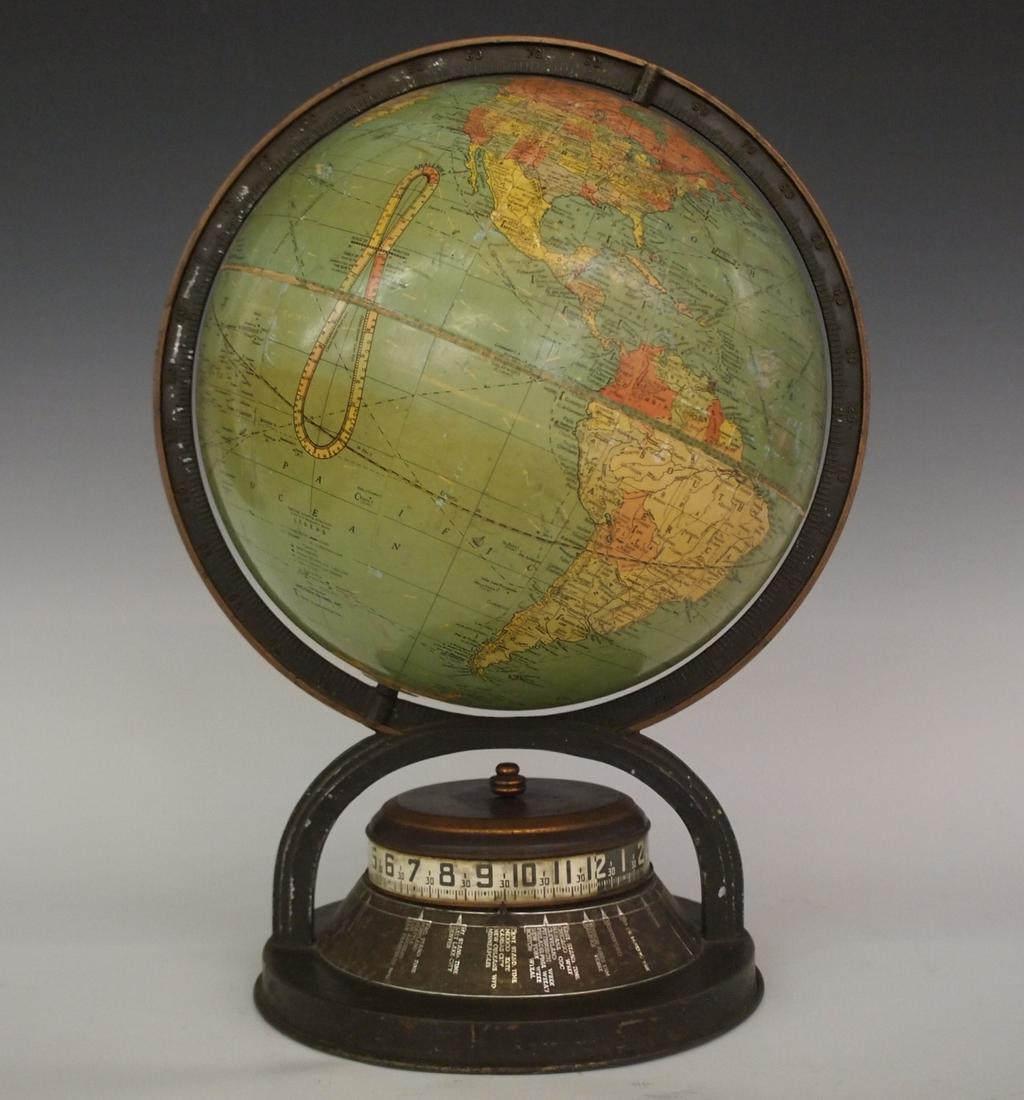 Lux/Replogle Globe Novelty clock: A mid 20th century Lux/Replogle Globe "World Time" Novelty clock. Lux 30 hr time only "Tape Measure" clock incorporated with a globe by Replogle Globe Co. of Chicago. Wear, some separation and loss to