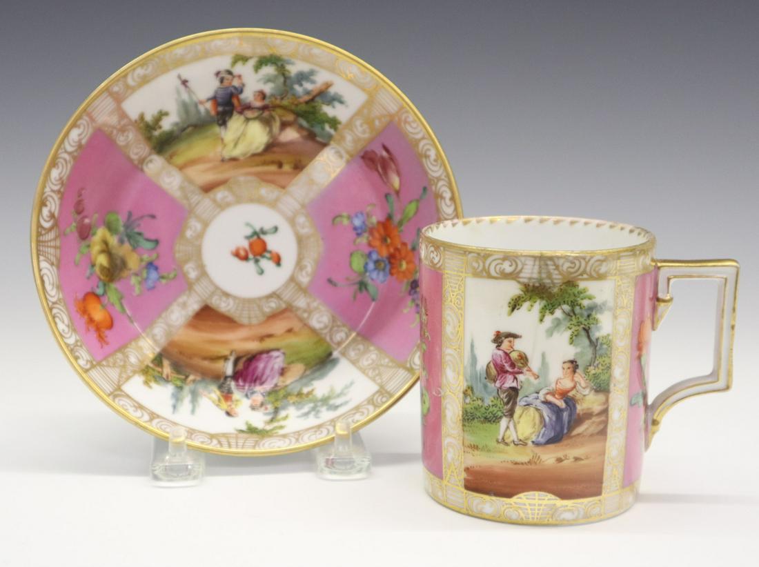 Royal Vienna Cabinet Cup & Saucer: A 19th Century Royal Vienna Cabinet Cup & Saucer. Hand painted with gilt accents and alternating vignettes of floral sprays on a pink background with courting scenes. Each piece with "Beehive" (shield