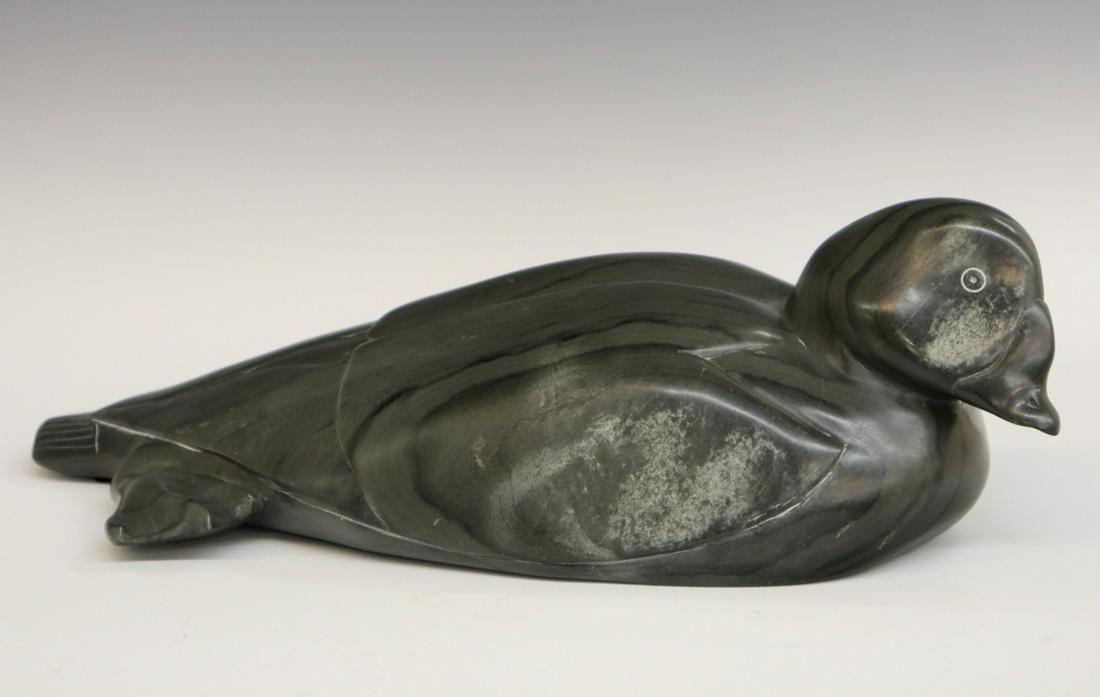 Paul Kavik sculpture: Paul Kavik, Canadian/Inuit (Sanikiluaq), b. 1948. Carved and highly polished stone sculpture of a duck, signed at the underside. Labels include "Carving Number 2302" and "Canada Eskimo Art". One area 