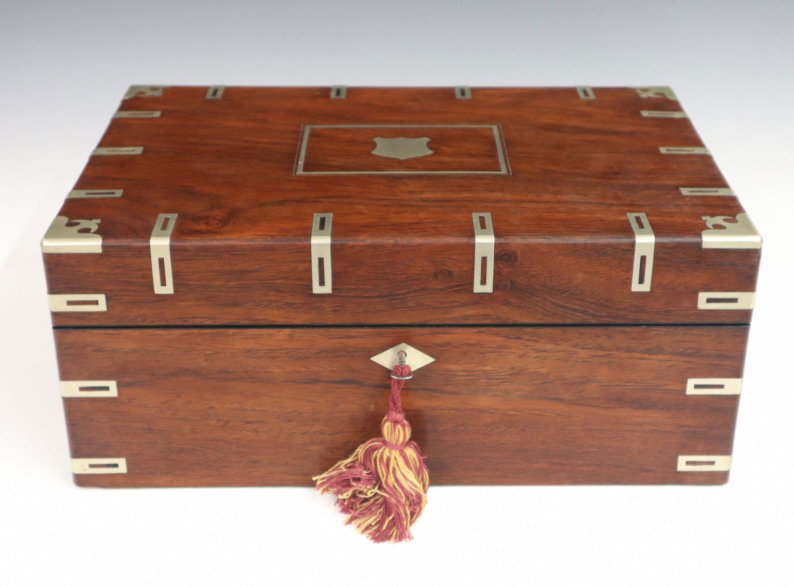 Victorian Lap Desk: A 19th century Victorian Period Rosewood lap desk with German Silver inlaid decoration. Tooled leather slope fitted with two ink bottles, a pen tray and nib compartment with lower stationary storage a