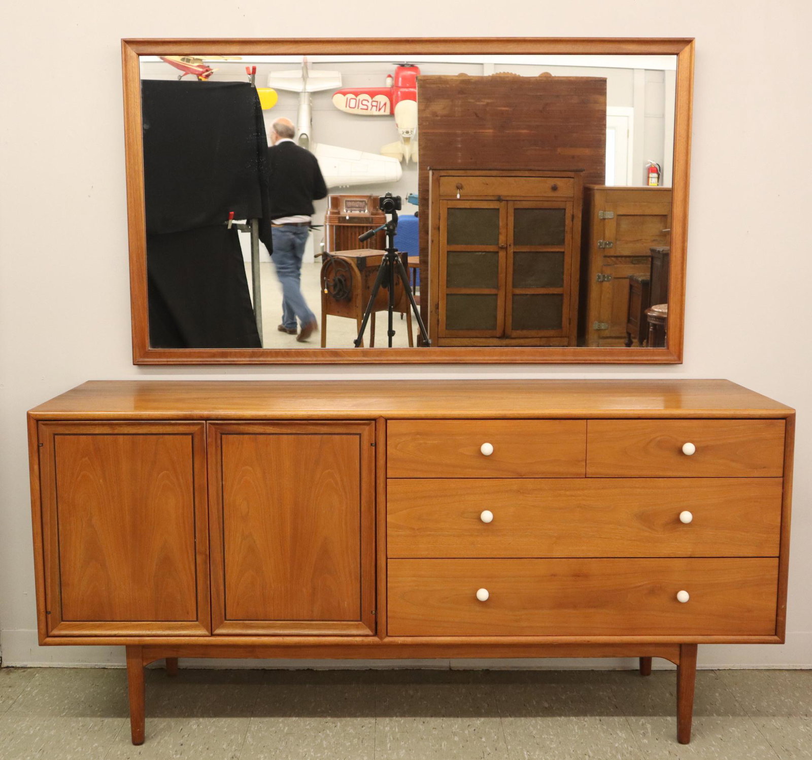 Drexel Declaration Dresser With Mirror: A 1960's Drexel "Declaration" dresser with mirror by Kipp Stewart. Low dresser with four drawers along side 2 doors which open to reveal six additional drawers #801-131-2. Original finish with slight 