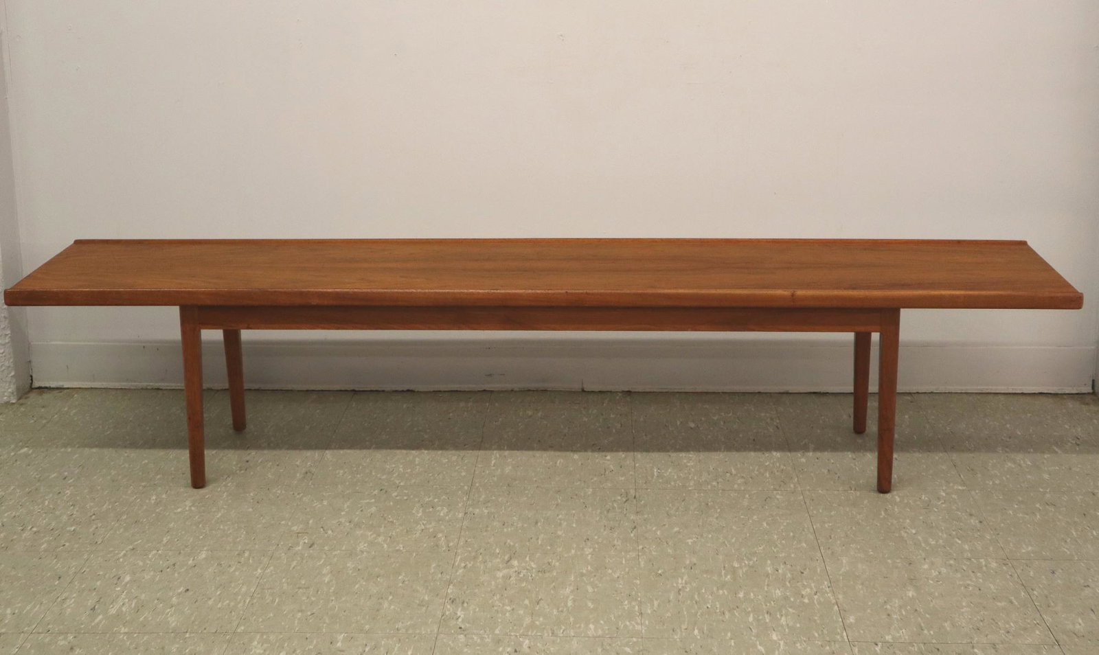 Drexel Declaration Coffee Table: A 1960's Drexel "Declaration" coffee table by Kipp Stewart. Rectangular table with rounded legs #881-21-1-5 dated 12/60. Original finish with minor wear. 75" long x 16" deep x 15 1/2" high. ESTIMATE $