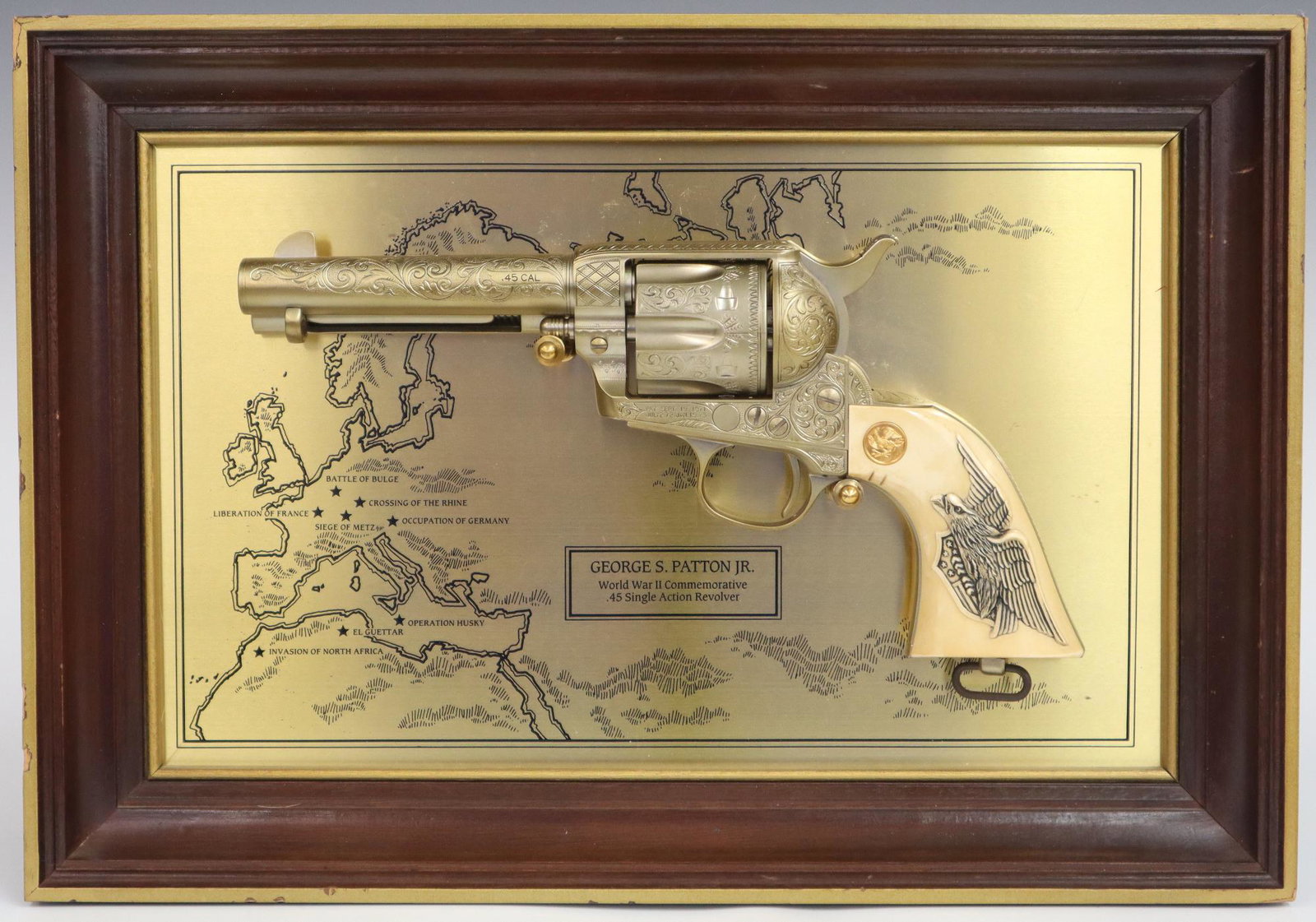 Franklin Mint Revolver: Franklin Mint General George S. Patton .45 S.A. non-firing Replica Revolver with display frame. Serial # 332088. Minor scratching and wear to gun and display frame. Frame is 15 1/4" x 10 3/4" high. ES