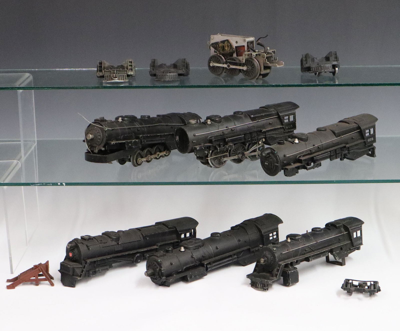 6 Lionel Locomotives: Six Post-War Lionel O Gauge Locomotives. All are incomplete and/or unassembled; includes #675, #2046 (2), #671, #1654, and #675. As is condition. Up to 11 1/4" long. ESTIMATE $50-100