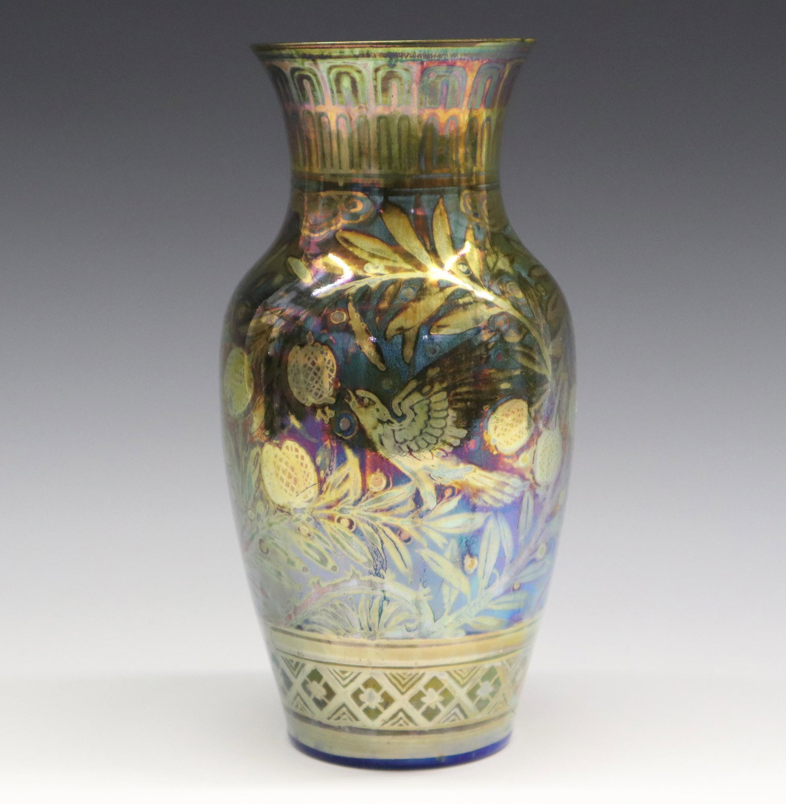 R. Joyce/Pilkington Vase: An Early 20th Century Art Pottery Vase by Richard Joyce for Pilkington. Baluster form vase with brilliant blue glaze at the interior and an olive green lustre glaze with blue accents about the exterio