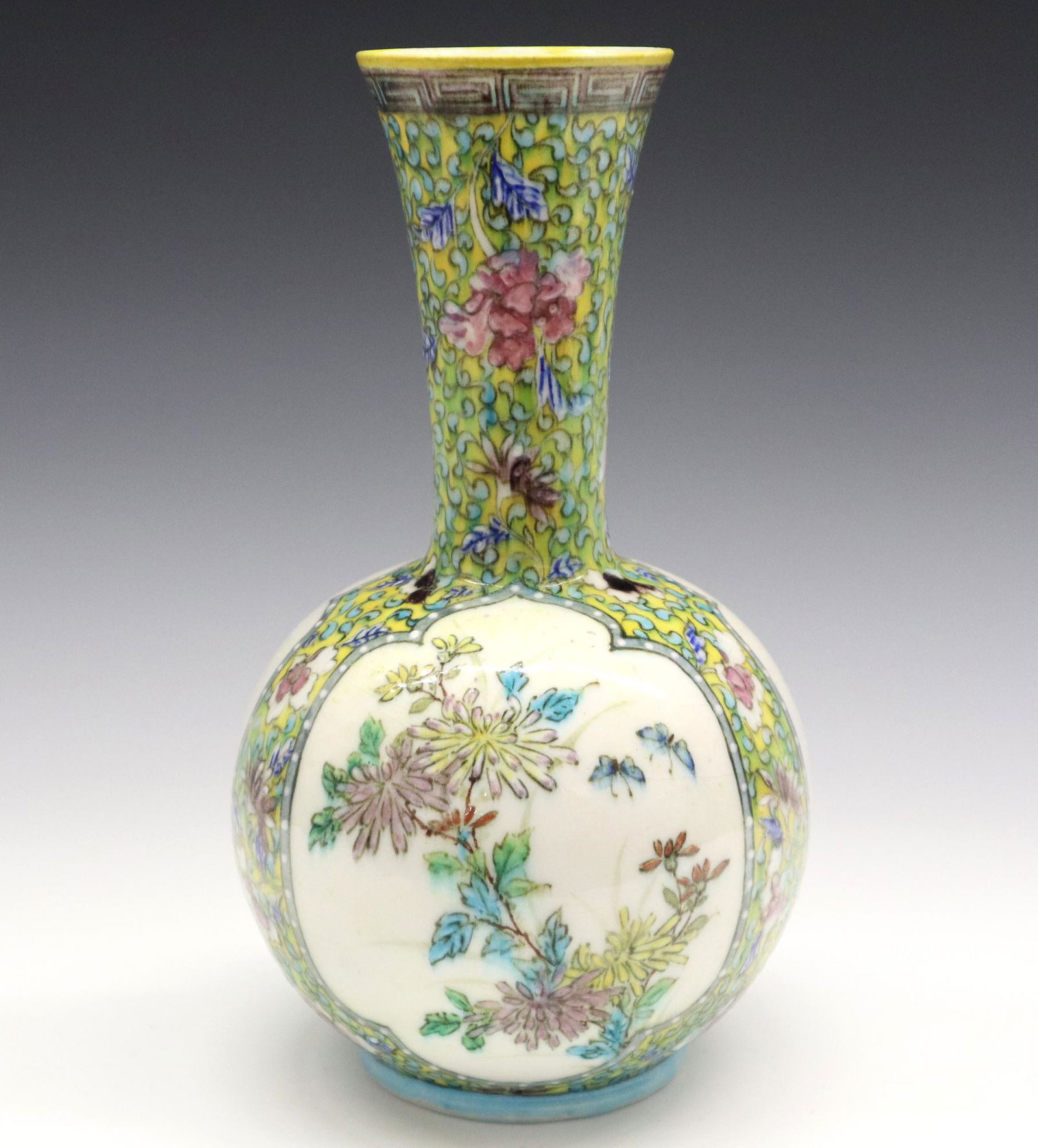 Th. Deck Vase: A 19th Century Theodore Deck Glazed Earthenware Vase. Bottle form vase with slightly flared lip is decorated in the Chinoiserie "Famille Jaune" style overall with Greek Key design at the lip, and flor