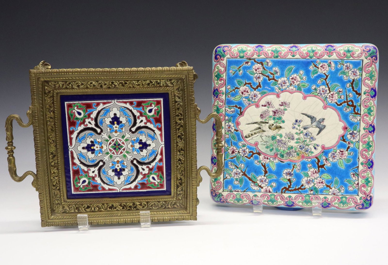 2 pcs of Longwy Ceramics: Two Late 19th to Early 20th Century Pieces of Longwy Ceramics. Including 1 kettle trivet on short molded legs with Chinoiserie motifs of flowering prunus and birds together with 1 bronze tray with han