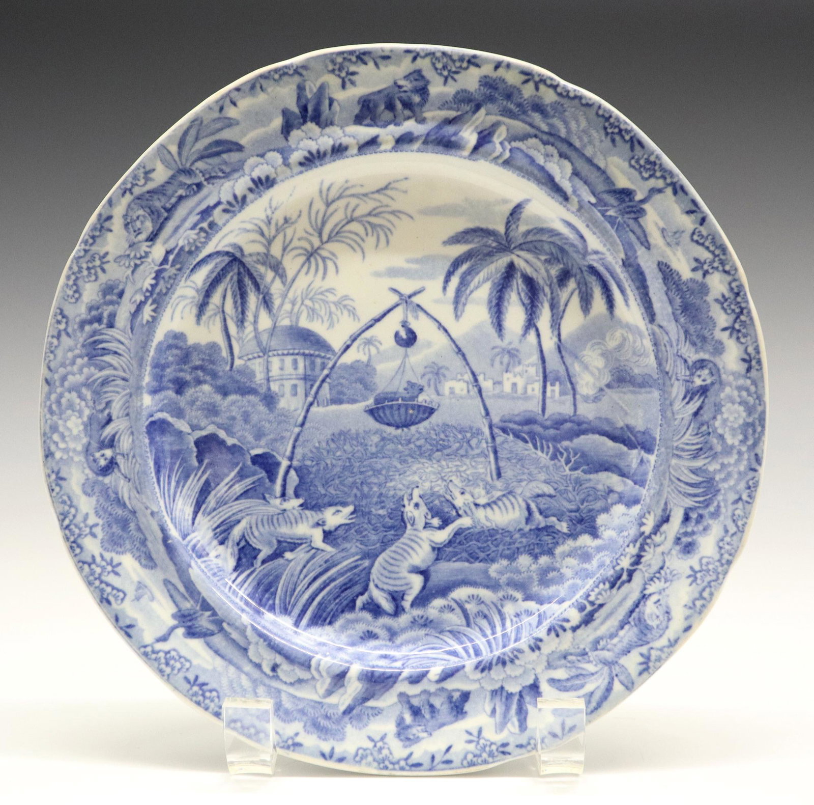 Spode Indian Sporting Series Plate: A 19th Century Spode "Indian Sporting Series" Plate. Round blue and white transferware plate with decorated with scene entitled "Common Wolf Trap" at the well which is contained within a border with a