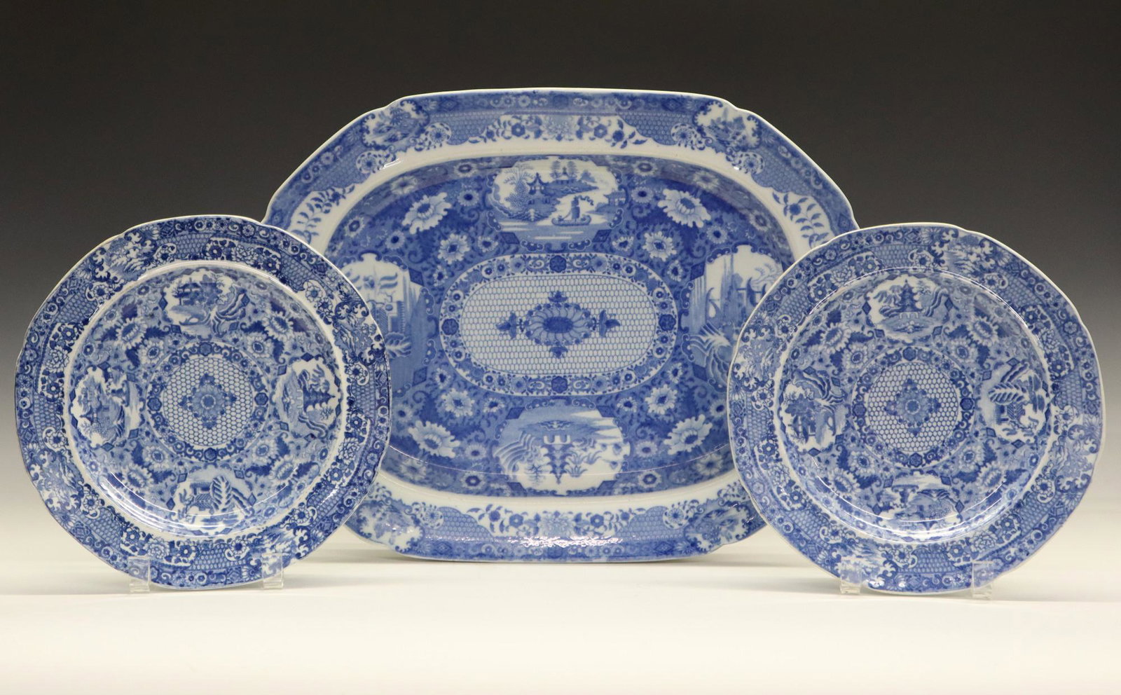 3 pcs of Spode "Net Pattern" Tableware: Three Pieces of 19th Century Spode "Net Pattern" Tableware. Blue and white English transferware includes 2 plates and 1 platter decorated with "net" motif along with floral patterns and four vignettes