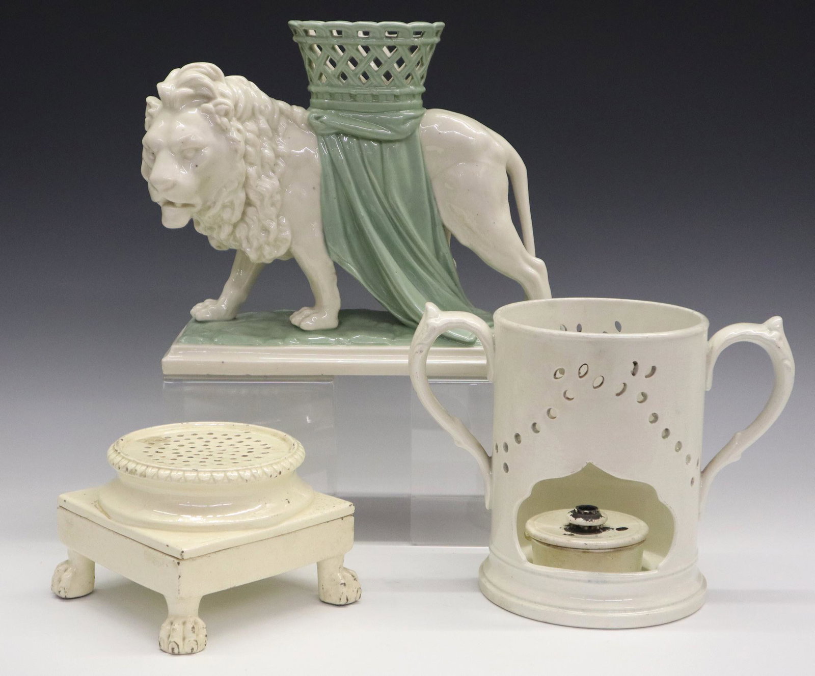 5 pcs of Porcelain: Five Pieces of 19th Century English Ceramics. Includes 4 pieces of Creamware consisting of an unmarked Sander and stand with lion's paw supports, and a Copeland partial warmer or Veilleuse (lacking to