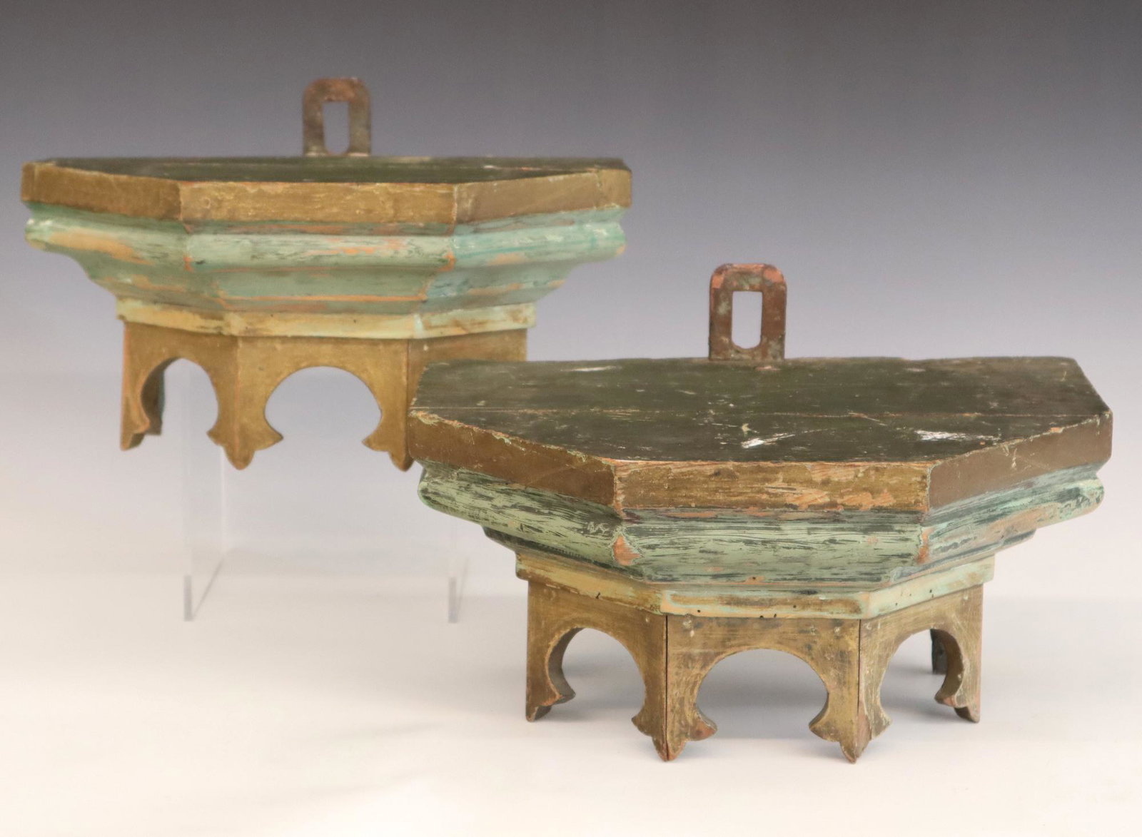 Pr Italian Painted Shelves: A pair of 19th century Italian wall shelves. Shaped tops with cut-out aprons. Original Polychrome painted finish and wrought iron hangers. Some wear and minor damage. Each 13" wide x 6 1/2" high. ESTI