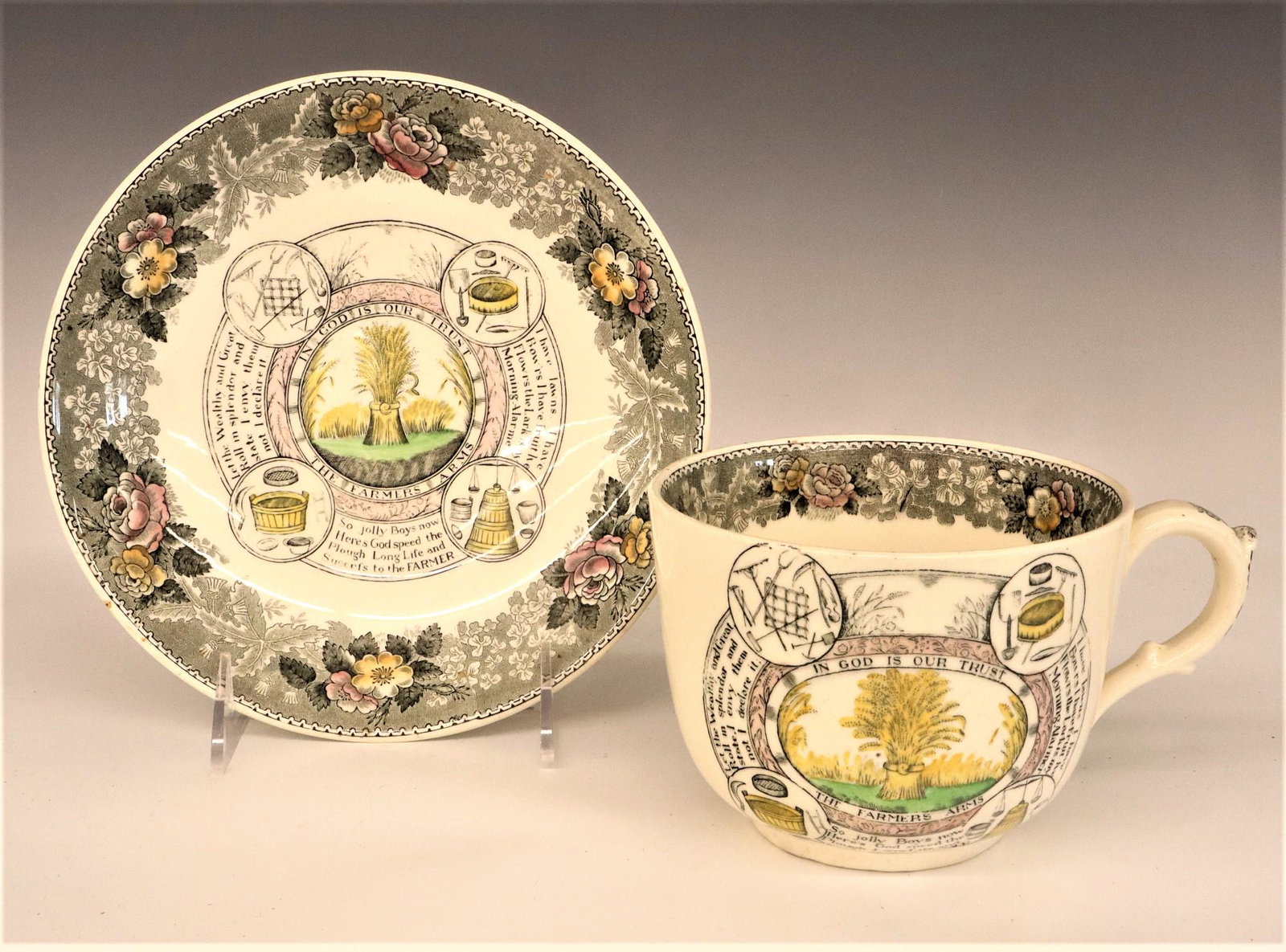 Adams Farmer's Cup And Saucer: A turn of the century Adams Farmer's cup and saucer. Transferware decoration with the "Farmer's Arms" motto. Printed mark. Minor wear to saucer. 4" high. ESTIMATE $50-75