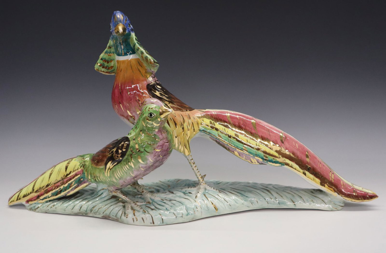 Italian Mid Mod Pheasant Figure: A mid century Italian porcelain figure of two pheasants. Multi-color glaze decoration with gilded detail. Slight wear to the gilding. 12 1/4" high overall. ESTIMATE $50-75