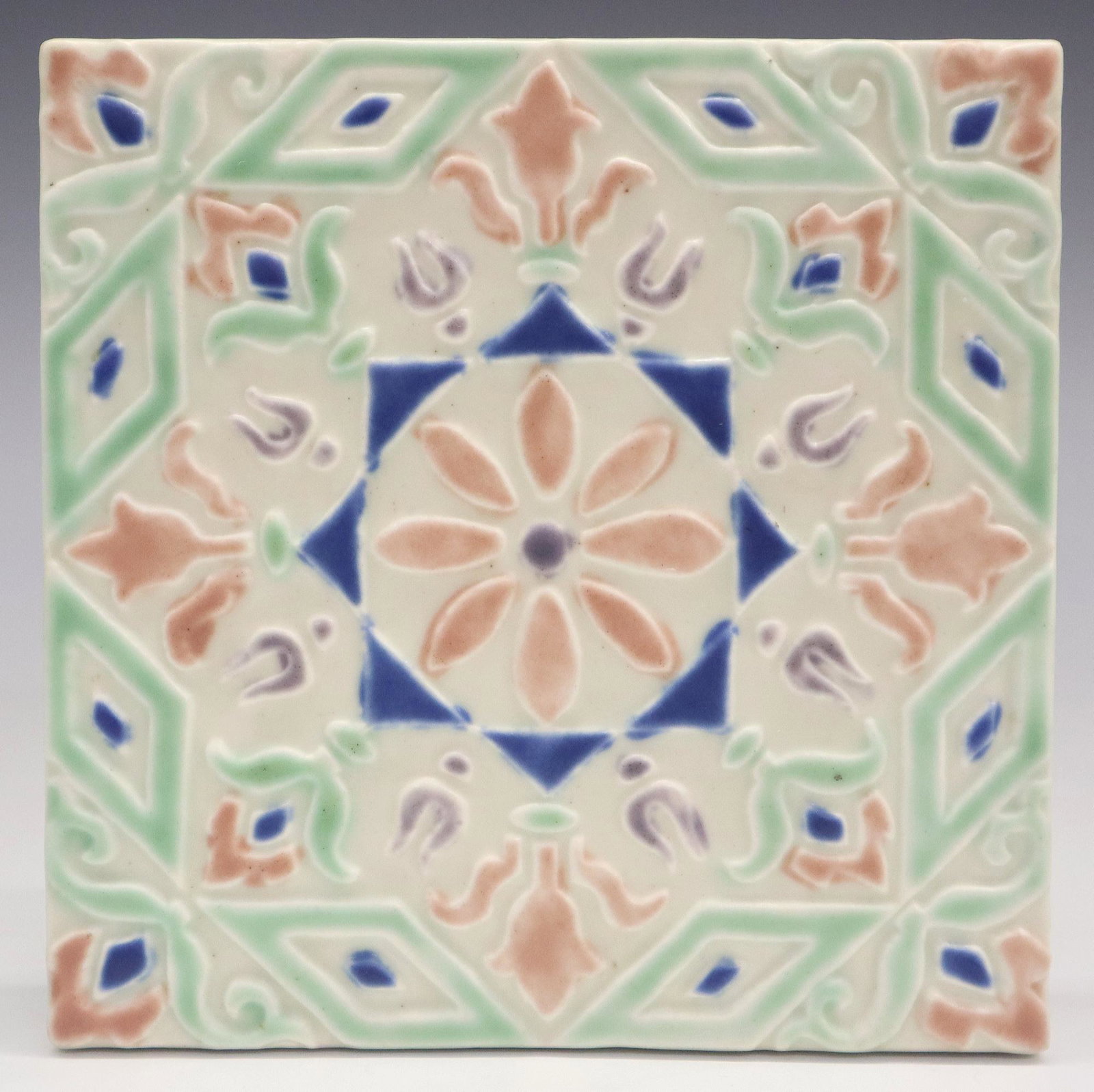 Rookwood Mosaic Trivet: A 20th century Rookwood "Mosaic" pattern trivet. Multi-color design with foliage. Impressed marks. Minor wear. 5 3/4" square. ESTIMATE $50-75
