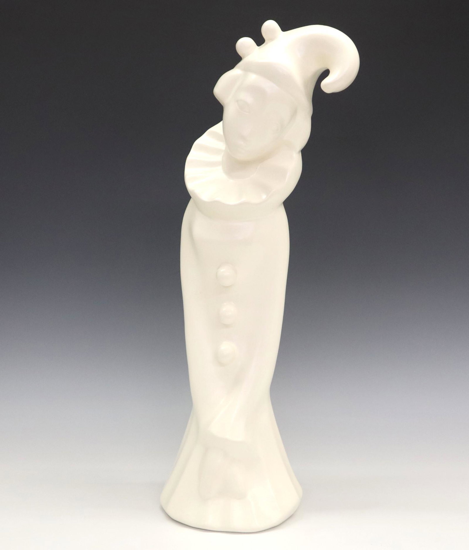 Brayton Pottery Clown Figure: A mid 20th century Brayton Pottery clown figure. Stylized female clown figure in White, mold #41-36. Impressed marks. Minor wear. 17 3/4" high. ESTIMATE $50-75